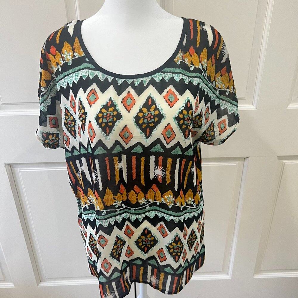 Under skies semi-sheer short sleeved blouse